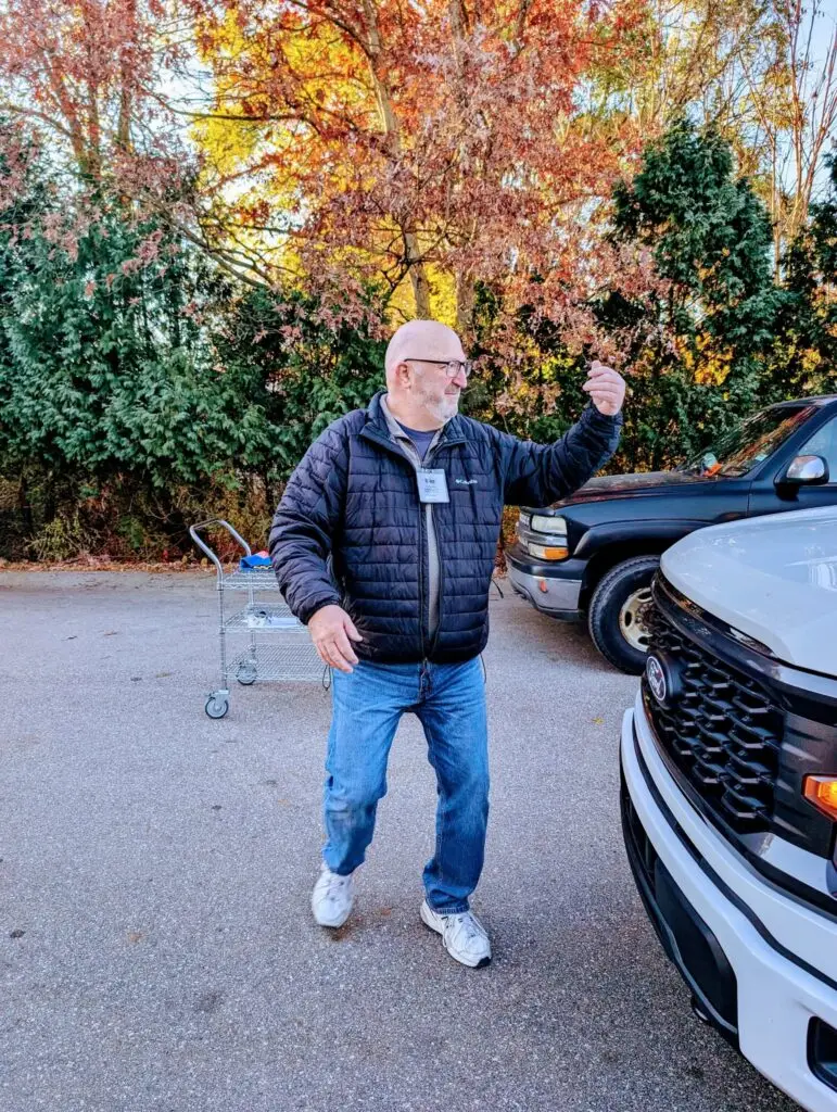 man directing traffic for donations