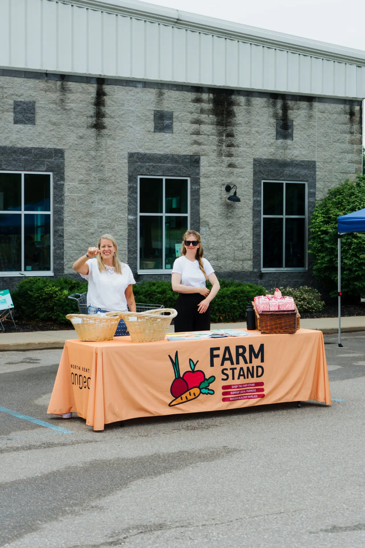 employees at farm stand table