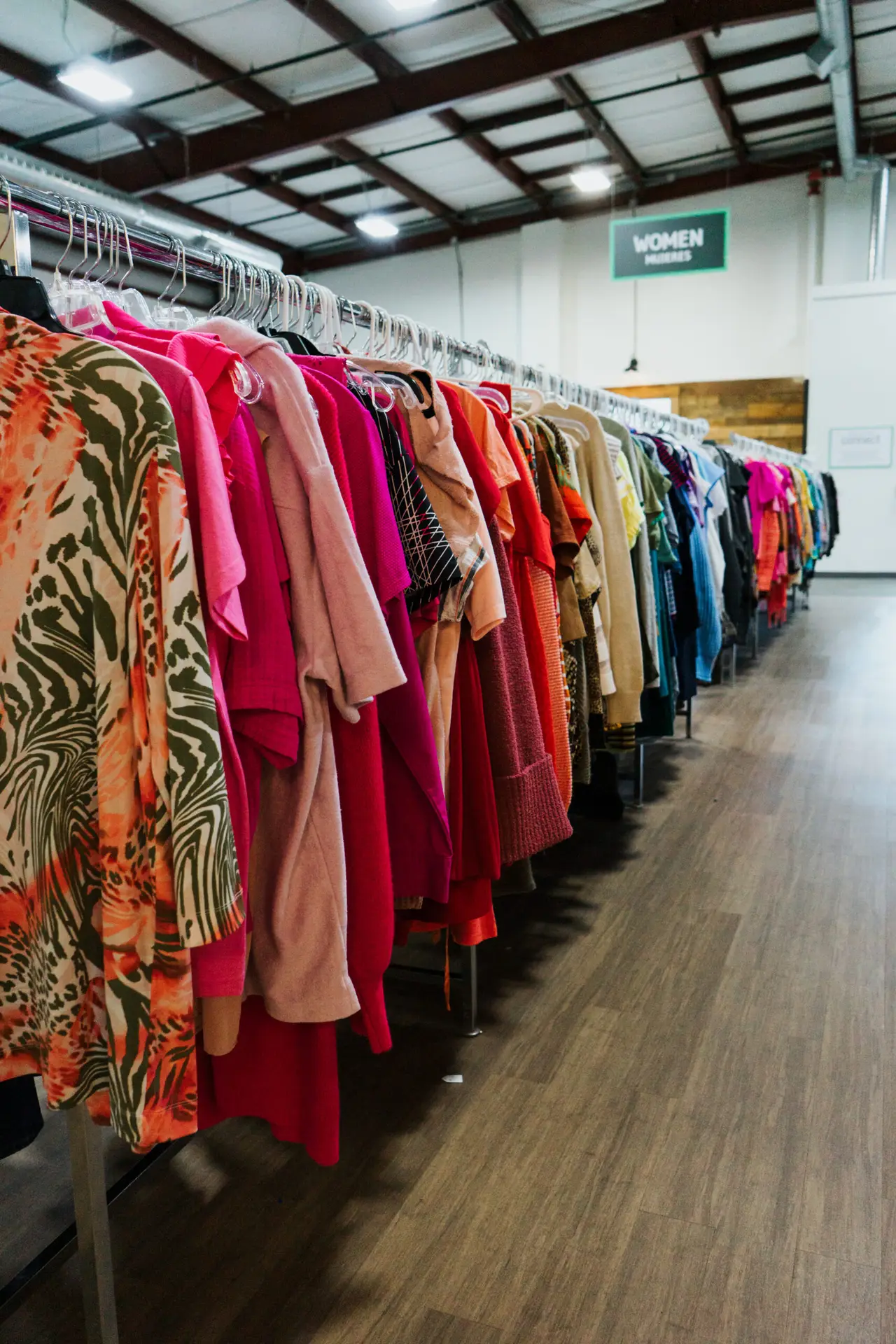 rack of women's clothes at thrift store