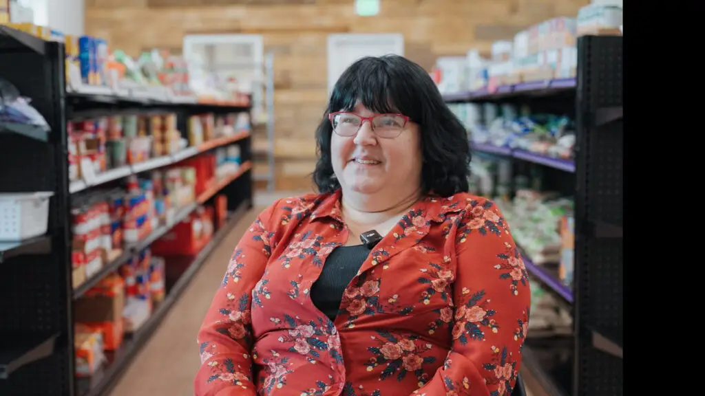 woman sitting in food pantry for interview