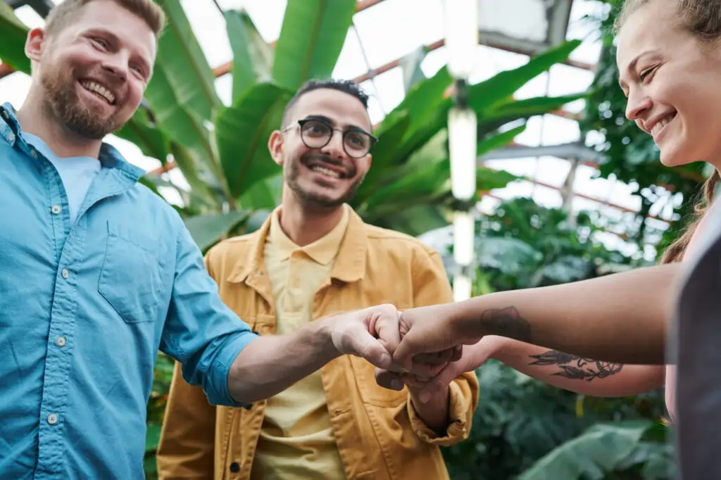 group of people fist bumping
