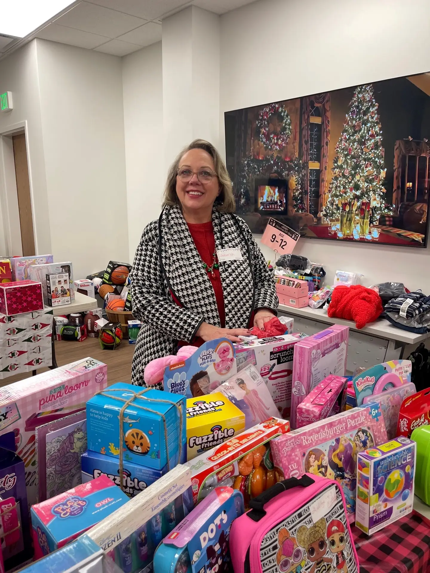 volunteer sorting through toy donations