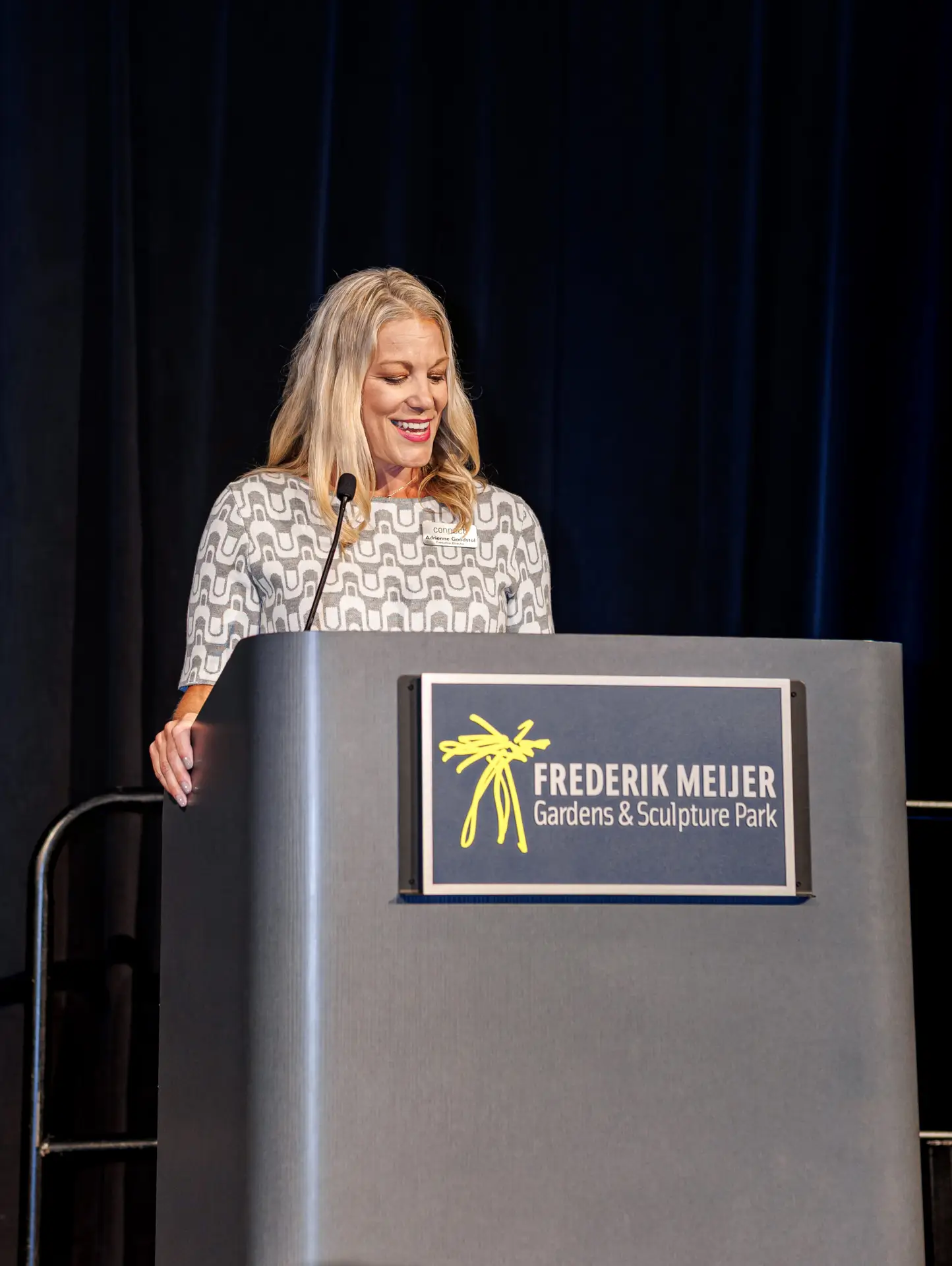 executive director giving speech at podium